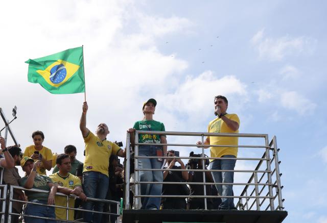 (260816) -- RIO DE JANEIRO, Aug. 16, 2026 (Xinhua) -- Brazilian Senator Flavio Bolsonaro (front R), presidential candidate of Brazil's Liberal Party, attends his first presidential campaign rally in Rio de Janeiro, Brazil, Aug. 16, 2026. (Xinhua/Jin Haoyuan)
