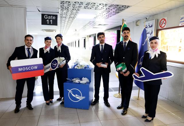 (260816) -- DAMASCUS, Aug. 16, 2026 (Xinhua) -- Syrian Airlines crew members pose for a photo during a ceremony marking the resumption of direct flights between Damascus and Moscow at Damascus International Airport in Damascus, Syria, Aug. 16, 2026. Syrian Airlines resumed regular direct flights between Damascus and Moscow on Sunday after a suspension of more than 18 months. (Photo by Ammar Safarjalani/Xinhua)