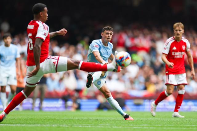 (260817) -- CARDIFF, Aug. 17, 2026 (Xinhua) -- Manchester City's Phil Foden (C) kicks the ball during the English Community Shield match between Arsenal and Manchester City in Cardiff, Britain, on Aug. 16, 2026. (Photo by Qian Jun/Xinhua)