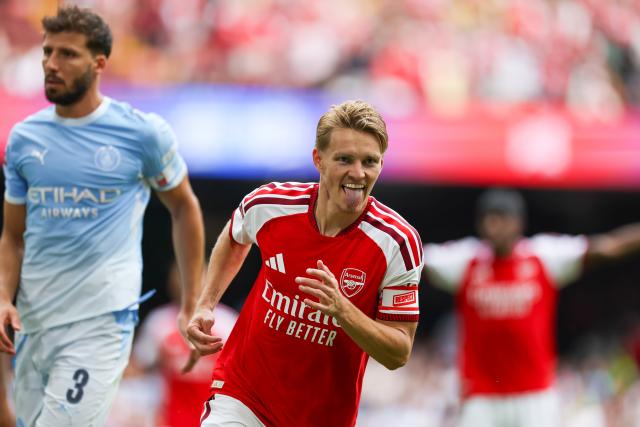 (260817) -- CARDIFF, Aug. 17, 2026 (Xinhua) -- Arsenal's Martin Odegaard (front) celebrates scoring during the English Community Shield match between Arsenal and Manchester City in Cardiff, Britain, on Aug. 16, 2026. (Photo by Qian Jun/Xinhua)