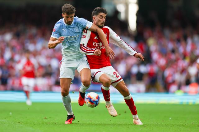 (260817) -- CARDIFF, Aug. 17, 2026 (Xinhua) -- Arsenal's Kai Havertz (R) vies with Manchester City's Ruben Dias during the English Community Shield match between Arsenal and Manchester City in Cardiff, Britain, on Aug. 16, 2026. (Photo by Qian Jun/Xinhua)