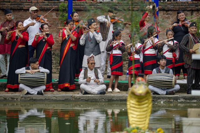 (260817) -- BHAKTAPUR, Aug. 17, 2026 (Xinhua) -- People in traditional attire perform during a celebration of Nag Panchami, a Hindu festival dedicated to the worship of snakes, in Bhaktapur, Nepal, Aug. 17, 2026. (Photo by Sulav Shrestha/Xinhua)