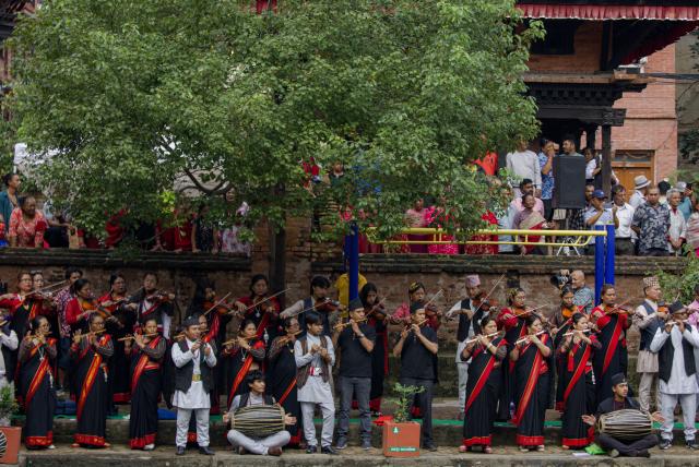 (260817) -- BHAKTAPUR, Aug. 17, 2026 (Xinhua) -- People in traditional attire perform during a celebration of Nag Panchami, a Hindu festival dedicated to the worship of snakes, in Bhaktapur, Nepal, Aug. 17, 2026. (Photo by Sulav Shrestha/Xinhua)