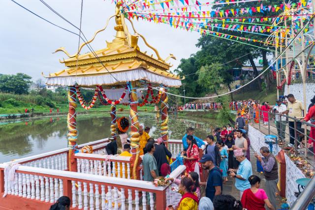 (260817) -- LALITPUR, Aug. 17, 2026 (Xinhua) -- People attend the celebration of Nag Panchami, a Hindu festival dedicated to the worship of snakes, on Nagdaha Lake in Lalitpur, Nepal, Aug. 17, 2026. (Photo by Hari Maharjan/Xinhua)