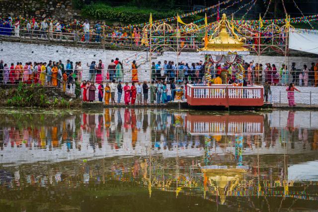 (260817) -- LALITPUR, Aug. 17, 2026 (Xinhua) -- People attend the celebration of Nag Panchami, a Hindu festival dedicated to the worship of snakes, on Nagdaha Lake in Lalitpur, Nepal, Aug. 17, 2026. (Photo by Hari Maharjan/Xinhua)