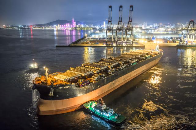 (260817) -- YANTAI, Aug. 17, 2026 (Xinhua) -- A drone photo taken on Aug. 16, 2026 shows a vessel carrying China-produced vehicles bound for Ghana departing from Yantai Port in east China's Shandong. Yantai Port's general cargo shipment volume to Africa has exceeded 6 million tonnes since the beginning of this year, a year-on-year increase of 66.1 percent. (Photo by Zhang Chao/Xinhua)
