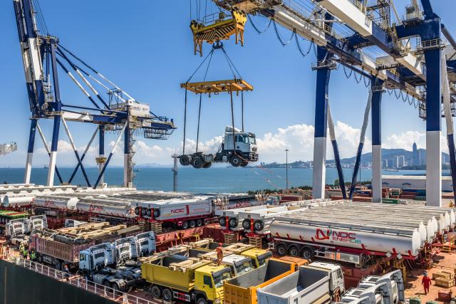 (260817) -- YANTAI, Aug. 17, 2026 (Xinhua) -- A drone photo taken on Aug. 16, 2026 shows China-produced trucks bound for Ghana being loaded onto a vessel at Yantai Port in east China's Shandong. Yantai Port's general cargo shipment volume to Africa has exceeded 6 million tonnes since the beginning of this year, a year-on-year increase of 66.1 percent. (Photo by Zhang Chao/Xinhua)