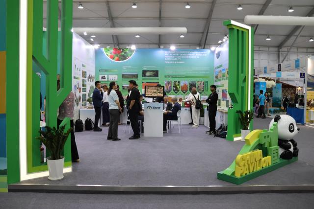 (260818) -- ULAN BATOR, Aug. 18, 2026 (Xinhua) -- People visit the exhibition area of the "China Corner" in the Blue Zone of the 17th Session of the Conference of the Parties (COP17) to the United Nations Convention to Combat Desertification (UNCCD) in Ulan Bator, Mongolia, Aug. 17, 2026. The "China Corner" themed exhibition made its debut on Monday, showcasing China's experience and achievements in combating desertification. (Xinhua/Bolortsetseg)