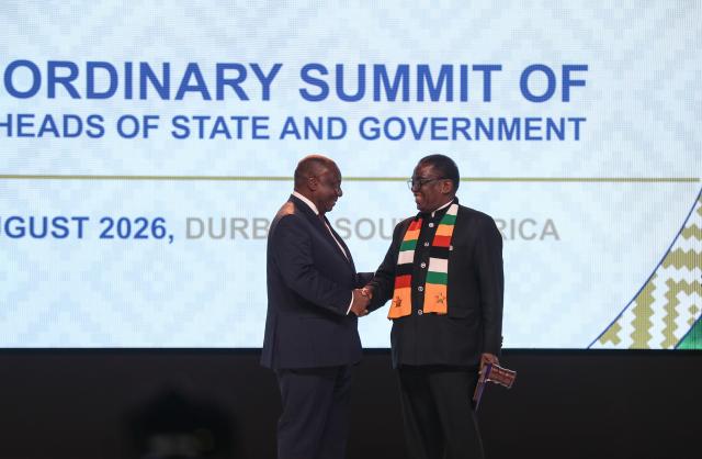 (260818) -- DURBAN, Aug. 18, 2026 (Xinhua) -- South African President Cyril Ramaphosa (L) shakes hands with Zimbabwean President Emmerson Mnangagwa as Ramaphosa succeeds Mnangagwa as the Southern African Development Community (SADC) chairperson during the opening ceremony of the 46th Ordinary Summit of the SADC Heads of State and Government in Durban, South Africa, Aug. 17, 2026.
  The summit opened Monday in South Africa's coastal city of Durban, with calls for deeper regional integration and stronger cooperation to advance industrialization and economic development.
  TO GO WITH "SADC summit opens in S. Africa's Durban with call for deeper regional integration" (Xinhua/Chen Wei)
