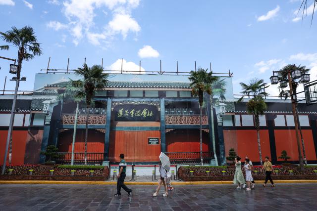(260818) -- ZUNYI, Aug. 18, 2026 (Xinhua) -- People walk past the entrance to the site of the Zunyi Meeting under renovation in Zunyi City, southwest China's Guizhou Province, Aug. 17, 2026.
  Renovation of the site of the Zunyi Meeting goes smoothly and will soon be completed. (Xinhua/Yang Wenbin)