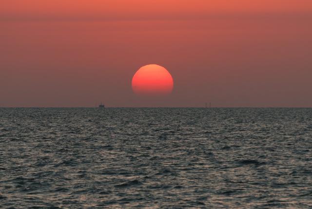 (260818) -- BAKU, Aug. 18, 2026 (Xinhua) -- This photo taken from a geophysical survey vessel operated by Caspian-Geo shows a view of the sunrise over the Caspian Sea near Baku, Azerbaijan, Aug. 18, 2026. (Xinhua/Chen Junfeng)