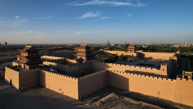(260818) -- BEIJING, Aug. 18, 2026 (Xinhua) -- An aerial drone photo taken on Aug. 5, 2026 shows a view of the Jiayu Pass at sunset in the city of Jiayuguan, northwest China's Gansu Province. Jiayuguan, the westernmost point of China's Ming Dynasty Great Wall, and the ancient city of Petra in Jordan are both landmarks boasting rich cultural heritage.
  In 2017, they established a twinhood relationship, built on the fact that both are UNESCO-listed World Heritage sites, distinguished by their unique and creative architecture in harmony with the natural environment.
  In 2025, the Chinese city of Jiayuguan and the Jordanian city of Petra signed an agreement on cooperation in culture and tourism at the archaeological site of Petra, seeking to strengthen the friendly ties between the two historical sites. (Xinhua/Chen Bin)