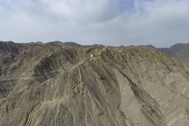(260818) -- BEIJING, Aug. 18, 2026 (Xinhua) -- An aerial drone photo taken on Oct. 29, 2025 shows a section of the Great Wall in the city of Jiayuguan, northwest China's Gansu Province. Jiayuguan, the westernmost point of China's Ming Dynasty Great Wall, and the ancient city of Petra in Jordan are both landmarks boasting rich cultural heritage.
  In 2017, they established a twinhood relationship, built on the fact that both are UNESCO-listed World Heritage sites, distinguished by their unique and creative architecture in harmony with the natural environment.
  In 2025, the Chinese city of Jiayuguan and the Jordanian city of Petra signed an agreement on cooperation in culture and tourism at the archaeological site of Petra, seeking to strengthen the friendly ties between the two historical sites. (Xinhua/Chen Bin)