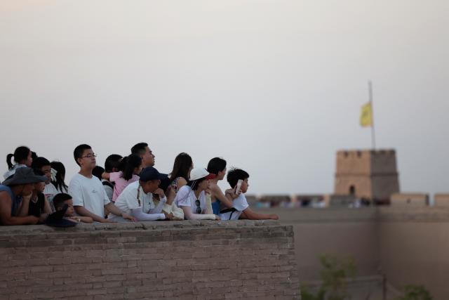 (260818) -- BEIJING, Aug. 18, 2026 (Xinhua) -- Tourists visit the Jiayu Pass in the city of Jiayuguan, northwest China's Gansu Province, Aug. 5, 2026. Jiayuguan, the westernmost point of China's Ming Dynasty Great Wall, and the ancient city of Petra in Jordan are both landmarks boasting rich cultural heritage.
  In 2017, they established a twinhood relationship, built on the fact that both are UNESCO-listed World Heritage sites, distinguished by their unique and creative architecture in harmony with the natural environment.
  In 2025, the Chinese city of Jiayuguan and the Jordanian city of Petra signed an agreement on cooperation in culture and tourism at the archaeological site of Petra, seeking to strengthen the friendly ties between the two historical sites. (Xinhua/Chen Bin)