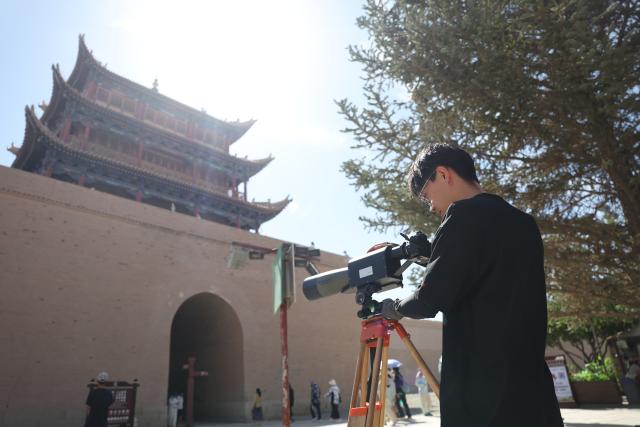 (260818) -- BEIJING, Aug. 18, 2026 (Xinhua) -- A technician from the cultural heritage monitoring center of the Jiayuguan Great Wall cultural research institute works inside the Jiayu Pass in the city of Jiayuguan, northwest China's Gansu Province, Aug. 6, 2026. Jiayuguan, the westernmost point of China's Ming Dynasty Great Wall, and the ancient city of Petra in Jordan are both landmarks boasting rich cultural heritage.
  In 2017, they established a twinhood relationship, built on the fact that both are UNESCO-listed World Heritage sites, distinguished by their unique and creative architecture in harmony with the natural environment.
  In 2025, the Chinese city of Jiayuguan and the Jordanian city of Petra signed an agreement on cooperation in culture and tourism at the archaeological site of Petra, seeking to strengthen the friendly ties between the two historical sites. (Xinhua/Chen Bin)