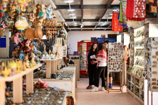 (260818) -- BEIJING, Aug. 18, 2026 (Xinhua) -- Tourists are seen inside a souvenir store in the ancient city of Petra, Jordan, July 23, 2026. Jiayuguan, the westernmost point of China's Ming Dynasty Great Wall, and the ancient city of Petra in Jordan are both landmarks boasting rich cultural heritage.
  In 2017, they established a twinhood relationship, built on the fact that both are UNESCO-listed World Heritage sites, distinguished by their unique and creative architecture in harmony with the natural environment.
  In 2025, the Chinese city of Jiayuguan and the Jordanian city of Petra signed an agreement on cooperation in culture and tourism at the archaeological site of Petra, seeking to strengthen the friendly ties between the two historical sites. (Xinhua/Xin Mengchen)