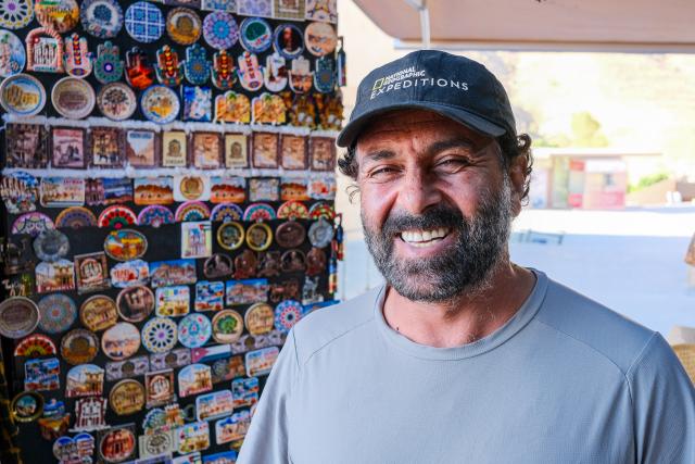 (260818) -- BEIJING, Aug. 18, 2026 (Xinhua) -- A local resident runs a souvenir store in the ancient city of Petra, Jordan, July 23, 2026. Jiayuguan, the westernmost point of China's Ming Dynasty Great Wall, and the ancient city of Petra in Jordan are both landmarks boasting rich cultural heritage.
  In 2017, they established a twinhood relationship, built on the fact that both are UNESCO-listed World Heritage sites, distinguished by their unique and creative architecture in harmony with the natural environment.
  In 2025, the Chinese city of Jiayuguan and the Jordanian city of Petra signed an agreement on cooperation in culture and tourism at the archaeological site of Petra, seeking to strengthen the friendly ties between the two historical sites. (Xinhua/Xin Mengchen)