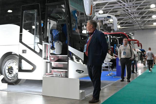 (260818) -- MOSCOW, Aug. 18, 2026 (Xinhua) -- People visit an international bus and coach exhibition at Crocus Expo International Exhibition Center in Moscow, Russia, on Aug. 18, 2026. The exhibition is held here from Tuesday to Friday, showcasing the latest passenger transport models, components, and advanced technologies. (Xinhua/Alexander Zemlianichenko Jr)