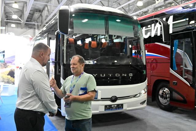 (260818) -- MOSCOW, Aug. 18, 2026 (Xinhua) -- People visit an international bus and coach exhibition at Crocus Expo International Exhibition Center in Moscow, Russia, on Aug. 18, 2026. The exhibition is held here from Tuesday to Friday, showcasing the latest passenger transport models, components, and advanced technologies. (Xinhua/Alexander Zemlianichenko Jr)