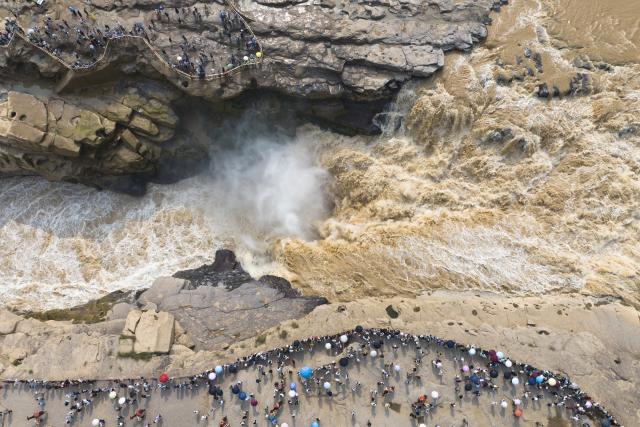 (260819) -- BEIJING, Aug. 19, 2026 (Xinhua) -- An aerial drone photo taken on Aug. 10, 2026 shows a view of the Yellow River's Hukou Waterfall on the border of north China's Shanxi Province and northwest China's Shaanxi Province. (Xinhua/Shao Rui)