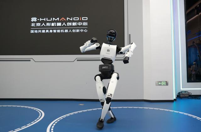 (260819) -- BEIJING, Aug. 19, 2026 (Xinhua) -- The humanoid robot Tiangong 3.0 dances at the Beijing Innovation Center of Humanoid Robotics in Beijing, capital of China, July 1, 2026. The Beijing Economic-Technological Development Area, also known as Beijing E-Town, has managed to cultivate and strengthen a modern system of emerging and forward-looking industries. (Photo by Ma Zihan/Xinhua)