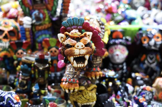 (260819) -- MEXICO CITY, Aug. 19, 2026 (Xinhua) -- Painted handicrafts are on display during the 12th Indigenous Cultures Festival at Constitution Square in Mexico City, capital of Mexico, Aug. 18, 2026. Inside a large exhibition tent, visitors browse goods and taste local specialty drinks, while artisans demonstrate traditional skills such as embroidery. The festival will run until Aug. 23. (Xinhua/Liu Wenhui)