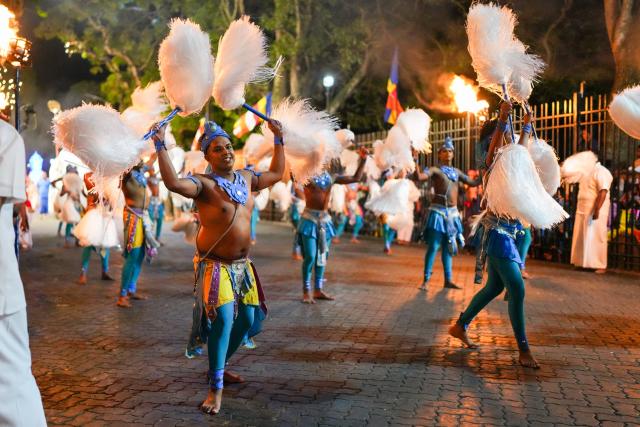 (260819) -- KANDY, Aug. 19, 2026 (Xinhua) -- Performers attend a procession celebrating the Esala Perahera festival in Kandy, Sri Lanka, on Aug. 18, 2026. Esala Perahera is one of the grandest Buddhist festivals in Sri Lanka, with a history of more than 1,000 years. (Photo by Thilina Kaluthotage/Xinhua)