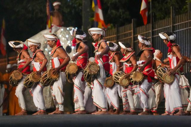 (260819) -- KANDY, Aug. 19, 2026 (Xinhua) -- Performers attend a procession celebrating the Esala Perahera festival in Kandy, Sri Lanka, on Aug. 18, 2026. Esala Perahera is one of the grandest Buddhist festivals in Sri Lanka, with a history of more than 1,000 years. (Photo by Thilina Kaluthotage/Xinhua)