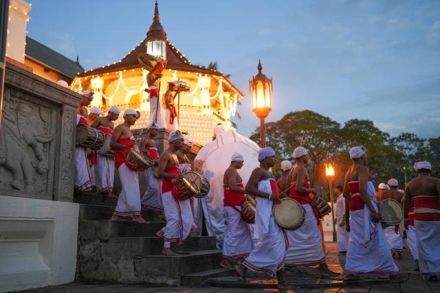(260819) -- KANDY, Aug. 19, 2026 (Xinhua) -- People attend a procession celebrating the Esala Perahera festival in Kandy, Sri Lanka, on Aug. 18, 2026. Esala Perahera is one of the grandest Buddhist festivals in Sri Lanka, with a history of more than 1,000 years. (Photo by Thilina Kaluthotage/Xinhua)