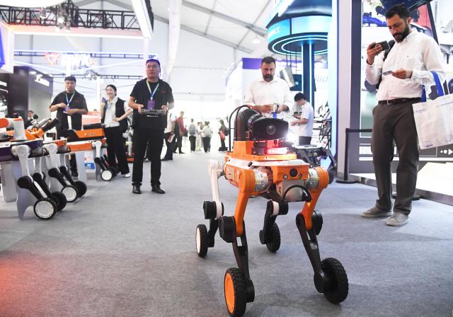 (260819) -- BEIJING, Aug. 19, 2026 (Xinhua) -- A robotic dog for detection is displayed during the 2026 World Robot Conference in Beijing, capital of China, Aug. 19, 2026. Themed "Human-Robot Symbiosis, Production-Demand Convergence," the 2026 edition of the conference kicked off here on Wednesday. (Xinhua/Ren Chao)