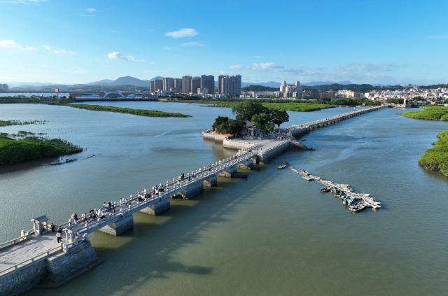 (260819) -- QUANZHOU, Aug. 19, 2026 (Xinhua) -- An aerial drone photo taken on Aug. 18, 2026 shows a view of Luoyang Bridge in Quanzhou, southeast China's Fujian Province. Luoyang Bridge, also known as Wan'an Bridge, is a component of the UNESCO World Heritage site "Quanzhou: Emporium of the World in Song-Yuan China." 
  In recent years, Quanzhou has woven cultural heritage into daily life by introducing intangible cultural heritage programs and cultural and creative businesses, attracting more tourists to the area. (Xinhua/Lin Shanchuan)