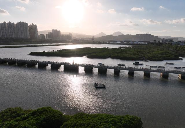 (260819) -- QUANZHOU, Aug. 19, 2026 (Xinhua) -- An aerial drone photo taken on Aug. 18, 2026 shows a view of Luoyang Bridge in Quanzhou, southeast China's Fujian Province. Luoyang Bridge, also known as Wan'an Bridge, is a component of the UNESCO World Heritage site "Quanzhou: Emporium of the World in Song-Yuan China." 
  In recent years, Quanzhou has woven cultural heritage into daily life by introducing intangible cultural heritage programs and cultural and creative businesses, attracting more tourists to the area. (Xinhua/Lin Shanchuan)