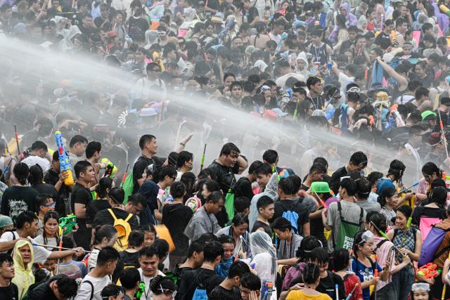 (260819) -- BAOTING, Aug. 19, 2026 (Xinhua) -- People attend a water festival held in Baoting Li and Miao Autonomous County, south China's Hainan Province, Aug. 19, 2026.
  A water festival is held here on Wednesday, on the occasion of the Qixi Festival, the Chinese version of the Valentine's Day. (Xinhua/Pu Xiaoxu)