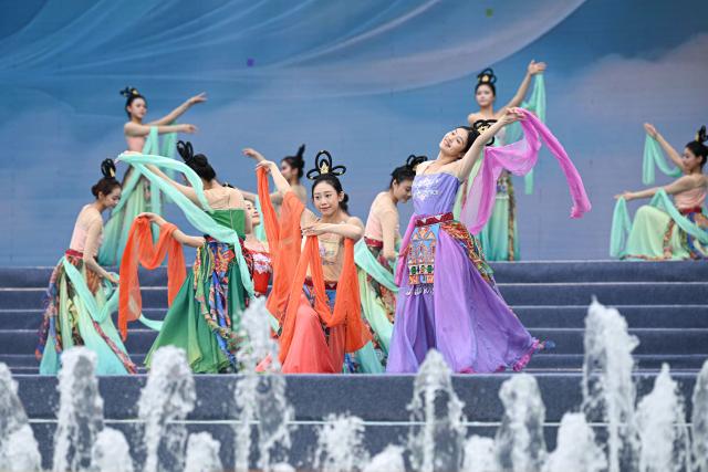 (260819) -- BAOTING, Aug. 19, 2026 (Xinhua) -- Dancers perform at the opening ceremony of a water festival held in Baoting Li and Miao Autonomous County, south China's Hainan Province, Aug. 19, 2026.
  A water festival is held here on Wednesday, on the occasion of the Qixi Festival, the Chinese version of the Valentine's Day. (Xinhua/Pu Xiaoxu)