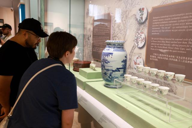 (260819) -- BISHKEK, Aug. 19, 2026 (Xinhua) -- People visit the exhibition "Harmony Creates Beauty: An Art Exhibition of Ancient Chinese Civilization" at the National History Museum of the Kyrgyz Republic in Bishkek, Kyrgyzstan, Aug. 18, 2026.
  The three-month exhibition, under the direction of China's National Cultural Heritage Administration, is jointly organized by the Tianjin Municipal Administration of Culture and Tourism, the Cultural Relics Bureau of the Inner Mongolia Autonomous Region, the Tianjin Museum, the Inner Mongolia Museum, the National History Museum of the Kyrgyz Republic, and the Chinese Cultural Center in Bishkek. (Photo by Roman Gainanov/Xinhua)