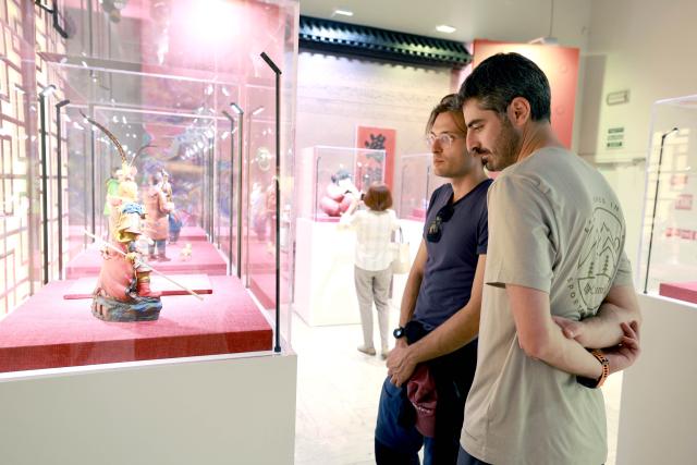(260819) -- BISHKEK, Aug. 19, 2026 (Xinhua) -- People visit the exhibition "Harmony Creates Beauty: An Art Exhibition of Ancient Chinese Civilization" at the National History Museum of the Kyrgyz Republic in Bishkek, Kyrgyzstan, Aug. 18, 2026.
  The three-month exhibition, under the direction of China's National Cultural Heritage Administration, is jointly organized by the Tianjin Municipal Administration of Culture and Tourism, the Cultural Relics Bureau of the Inner Mongolia Autonomous Region, the Tianjin Museum, the Inner Mongolia Museum, the National History Museum of the Kyrgyz Republic, and the Chinese Cultural Center in Bishkek. (Photo by Roman Gainanov/Xinhua)