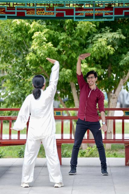 (260819) -- YINCHUAN, Aug. 19, 2026 (Xinhua) -- Mohammad Abdi (R) learns Baduanjin, a traditional Chinese breathing and stretching exercise, at Ningxia Chinese Medicine Research Center in Yinchuan, northwest China's Ningxia Hui Autonomous Region, on Aug. 15, 2026. Mohammad Abdi, a 26-year-old Iranian student, came to China in 2023 to study clinical medicine at Ningxia Medical University.
   He was introduced to traditional Chinese medicine (TCM) at an early age. After seeing his uncle receive cupping therapy in Iran, he became curious about this traditional medical practice. Later, as a medical student in China, he had the opportunity to take professional TCM courses. On weekends, Abdi visits Ningxia Chinese Medicine Research Center to experience various TCM therapies.
   "I was a gym rat, so I initially thought TCM practices were too simple to be effective," he said. However, as he learned more about TCM, he was impressed by its depth and effectiveness. He recommended Baduanjin, a traditional Chinese breathing and stretching exercise, to his fellow international students, while he especially enjoys tuina massage combined with cupping therapy, which helps relieve the stress of his studies and clinical internship.
   For Abdi, TCM is more than a way to treat diseases; it is also a health philosophy that can be integrated into daily life. He believes ordinary people can benefit from TCM-based wellness practices, while professional doctors can use TCM techniques to treat patients.
   TCM is now expanding its global presence and joining the worldwide conversation on health and lifestyle. Inspired by growing interest in Chinese lifestyles overseas, Abdi hopes to continue exploring TCM and become a skilled doctor, helping more people in his hometown benefit from traditional Chinese medicine. (Xinhua/Yang Zhisen)