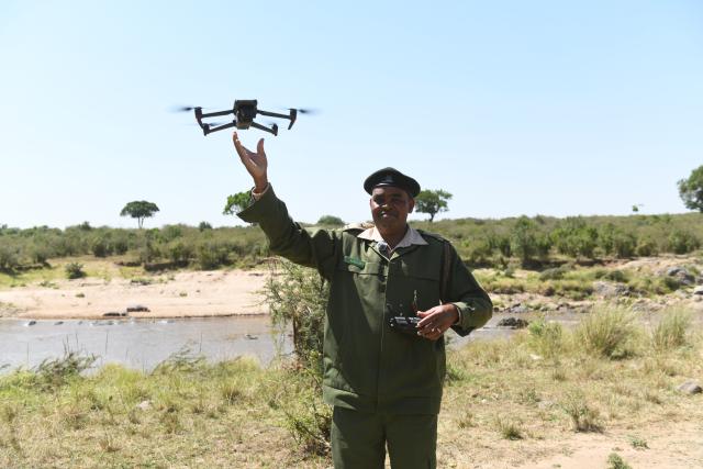 (260819) -- NAIROBI, Aug. 19, 2026 (Xinhua) -- Ranger Alfred Bett carries out a drone patrol in the Maasai Mara National Reserve, Kenya, Aug. 14, 2026. TO GO WITH "Feature: Drones, cameras sharpen wildlife protection in Kenya's Maasai Mara" (Xinhua/Liu Qiong)