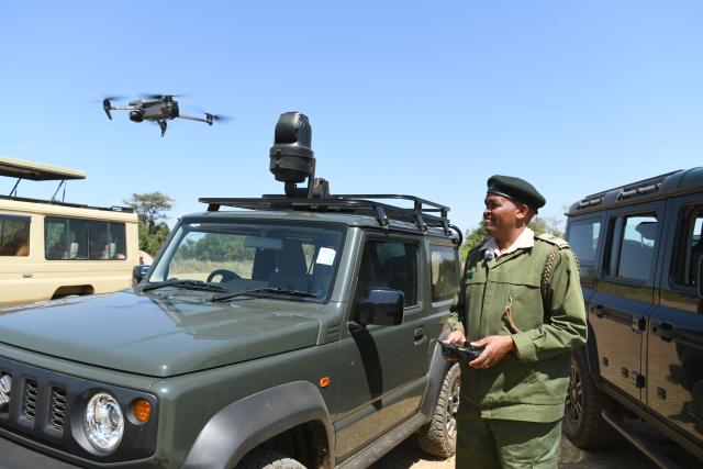 (260819) -- NAIROBI, Aug. 19, 2026 (Xinhua) -- Ranger Alfred Bett carries out a drone patrol in the Maasai Mara National Reserve, Kenya, Aug. 14, 2026. TO GO WITH "Feature: Drones, cameras sharpen wildlife protection in Kenya's Maasai Mara" (Xinhua/Liu Qiong)