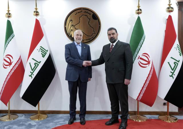(260819) -- BAGHDAD, Aug. 19, 2026 (Xinhua) -- Iraqi Parliament Speaker Haibet al-Halbousi (R) shakes hands with visiting Iranian Parliament Speaker Mohammad Bagher Ghalibaf in Baghdad, Iraq, Aug. 19, 2026. (Media Office of the Speaker of the Iraqi Parliament/Handout via Xinhua)