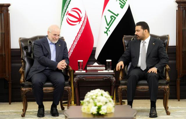 (260819) -- BAGHDAD, Aug. 19, 2026 (Xinhua) -- Iraqi Prime Minister Ali al-Zaidi (R) meets with visiting Iranian Parliament Speaker Mohammad Bagher Ghalibaf in Baghdad, Iraq, Aug. 19, 2026. (Iraqi Prime Minister Media Office/Handout via Xinhua)