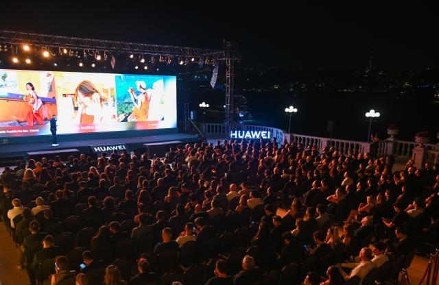(260819) -- ISTANBUL, Aug. 19, 2026 (Xinhua) -- People attend Huawei's new product launch event in Istanbul, Türkiye, Aug. 19, 2026. On Wednesday evening, Huawei held a product launch event in Istanbul, unveiling the Pura 90s series smartphones, tablets, smart wearables and other products for the Turkish market. (Xinhua/Liu Lei)