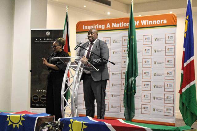(260820) -- CAPE TOWN, Aug. 20, 2026 (Xinhua) -- South African Minister of Sport, Arts and Culture Gayton McKenzie (R) speaks during a repatriation ceremony at the Iziko South African Museum in Cape Town, South Africa, Aug. 19, 2026. TO GO WITH "South Africa returns ancestral remains to Namibia for colonial redress, healing" (Photo by Shakirah Thebus/Xinhua)