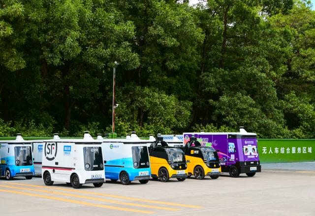 (260820) -- SHENZHEN, Aug. 20, 2026 (Xinhua) -- Functional autonomous vehicles from various logistics service providers are parked at a pilot depot in Longgang District, Shenzhen, south China's Guangdong Province, Sept. 3, 2025.
  Logistics service providers in Shenzhen have accelerated the commercial deployment of functional autonomous vehicles in recent years, an effort which has helped reduce the physical workload of courier workers while improving delivery efficiency. 
   As of July 2026, there are a total of 837 functional autonomous vehicles operating in Shenzhen's logistics sector, serving 2,890 routes with a road coverage of around 13,000 kilometers. (Photo by Song Jinrong/Xinhua)