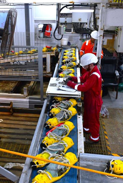 (260820) -- BAKU, Aug. 20, 2026 (Xinhua) -- Chinese and Azerbaijani technicians deploy yellow-cased Ocean Bottom Node (OBN) seismic instruments to the seabed aboard a seismic vessel of the Caspian Geophysical Company in the Caspian Sea near Baku, Azerbaijan, Aug. 18, 2026. Chinese and Azerbaijani oil-gas exploration technicians aboard the seismic vessel worked together to deploy OBN seismic instruments into the waters of the Caspian Sea, and conduct data analysis on Wednesday night.
   The vessel is operated by the Caspian Geophysical Company, a joint venture between China and Azerbaijan. (Xinhua/Chen Junfeng)
