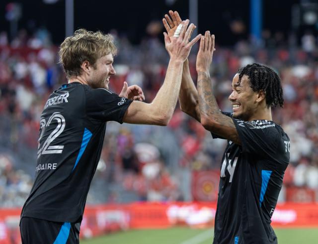 (260820) -- TORONTO, Aug. 20, 2026 (Xinhua) -- Henry Kessler (L) of Charlotte FC celebrates scoring with teammate Idan Toklomati during the 2026 Major League Soccer (MLS) regular season match between Toronto FC and Charlotte FC at BMO Field in Toronto, Canada, on Aug. 19, 2026. (Photo by Zou Zheng/Xinhua)