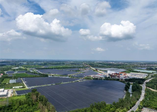 (260820) -- NANJING, Aug. 20, 2026 (Xinhua) -- An aerial drone photo taken on Aug. 19, 2026 shows a photovoltaic power project in Taizhou, east China's Jiangsu Province. The overall installed capacity of photovoltaic power-generating facilities in Jiangsu has exceeded 100-gigawatt mark to reach 100.08 gigawatts by the end of July 2026, according to the State Grid Jiangsu Electric Power Company. (Photo by Tang Dehong/Xinhua)