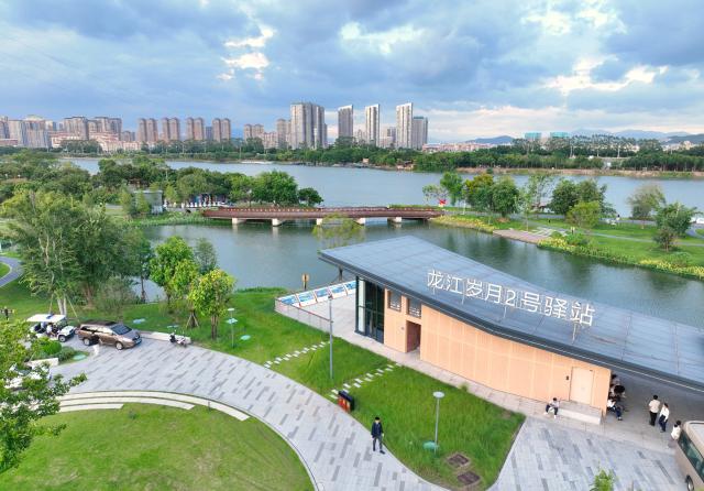 (260820) -- ZHANGZHOU, Aug. 20, 2026 (Xinhua) -- An aerial drone photo taken on Aug. 19, 2026 shows a view of Longjiang Suiyue park in Zhangzhou, southeast China's Fujian Province. Longjiang Suiyue park, a cultural and tourism complex, was transformed from an area with dilapidated buildings, widespread garbage, and wasted water. The renovated park officially opened on Dec. 31, 2024, and has attracted over 18 million visitors as of this June. (Xinhua/Lin Shanchuan)