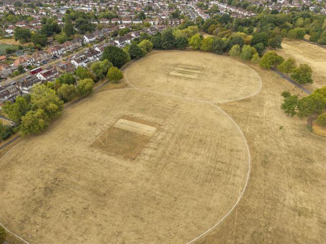 (260820) -- LONDON, Aug. 20, 2026 (Xinhua) -- An aerial drone photo taken on Aug. 19, 2026 shows parched grassland at a recreation ground in London, Britain. In Britain, extreme dryness has become a defining feature of the summer. Provisional data from the Met Office showed that England and Wales experienced their driest July on record, while nearly three-quarters of England was officially under drought conditions by Aug. 10. (Photo by Ray Tang/Xinhua)