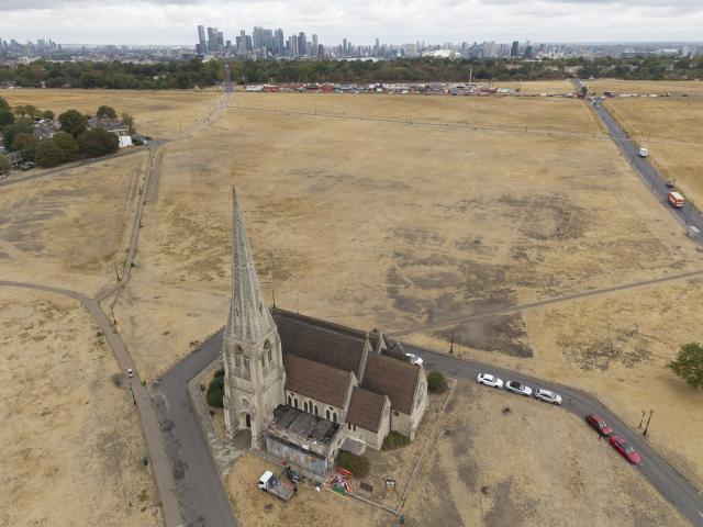 (260820) -- LONDON, Aug. 20, 2026 (Xinhua) -- A drone photo taken on Aug. 19, 2026 shows parched grassland at Blackheath in London, Britain. In Britain, extreme dryness has become a defining feature of the summer. Provisional data from the Met Office showed that England and Wales experienced their driest July on record, while nearly three-quarters of England was officially under drought conditions by Aug. 10. (Photo by Ray Tang/Xinhua)